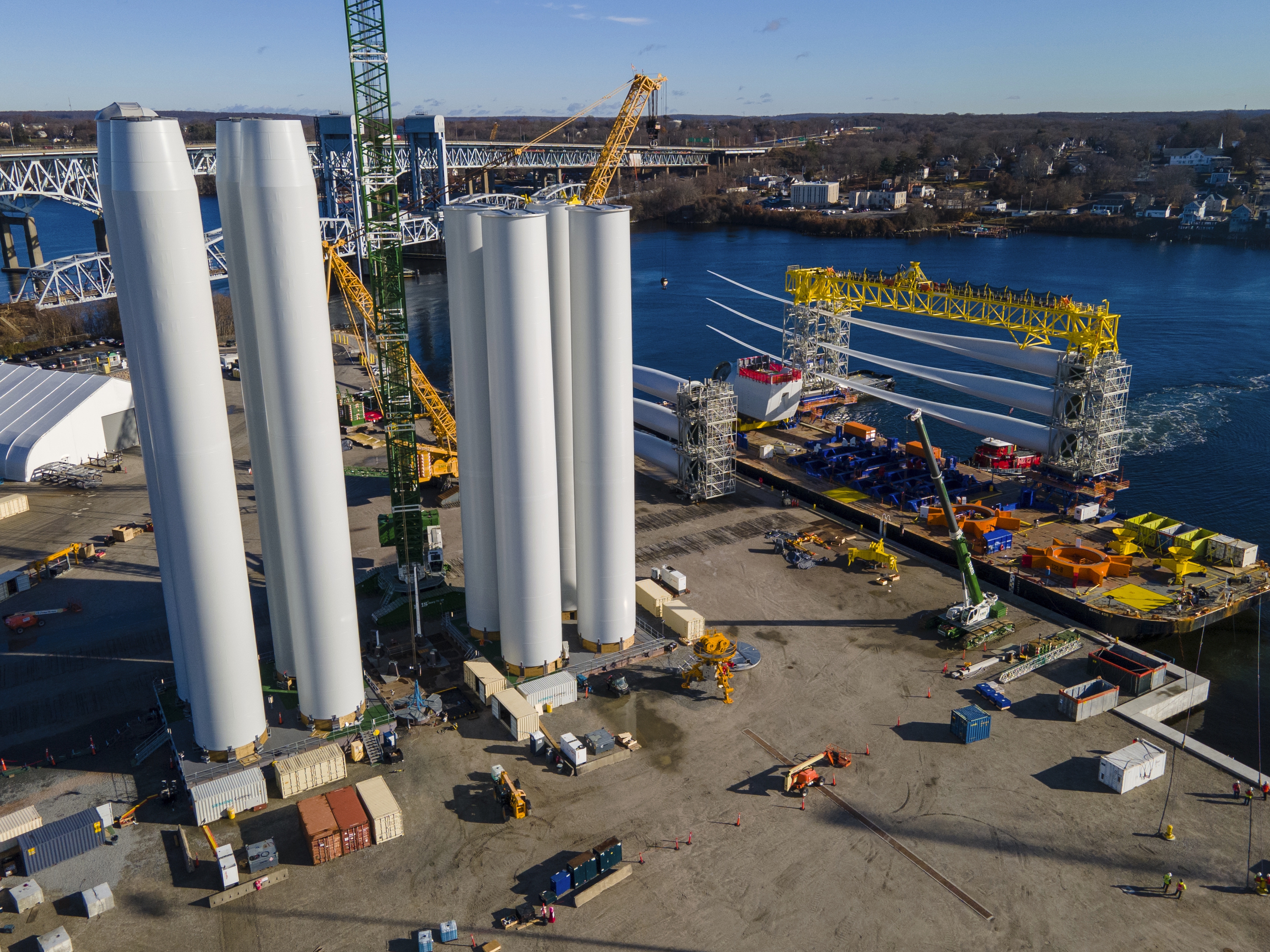 caption: Ports around the country are vying to become hubs for offshore wind farms, like the State Pier in New London, Conn., which is supplying the South Fork Wind farm offshore.