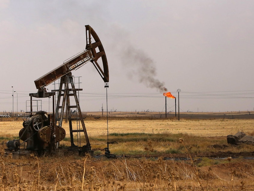 caption: Oil well pumps are seen in Syria's northeastern Hasakeh province in 2015. President Trump is renewing his push for U.S. control of Syrian oil.