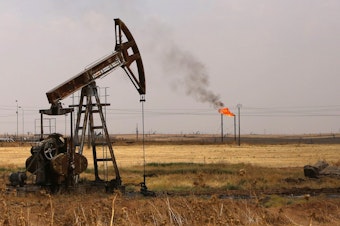 caption: Oil well pumps are seen in Syria's northeastern Hasakeh province in 2015. President Trump is renewing his push for U.S. control of Syrian oil.