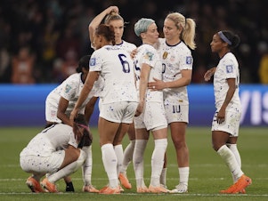 caption: U.S. players react following their loss to Sweden in a penalty shootout during the Women's World Cup round of 16 soccer match in Melbourne, Australia, Sunday, Aug. 6, 2023.