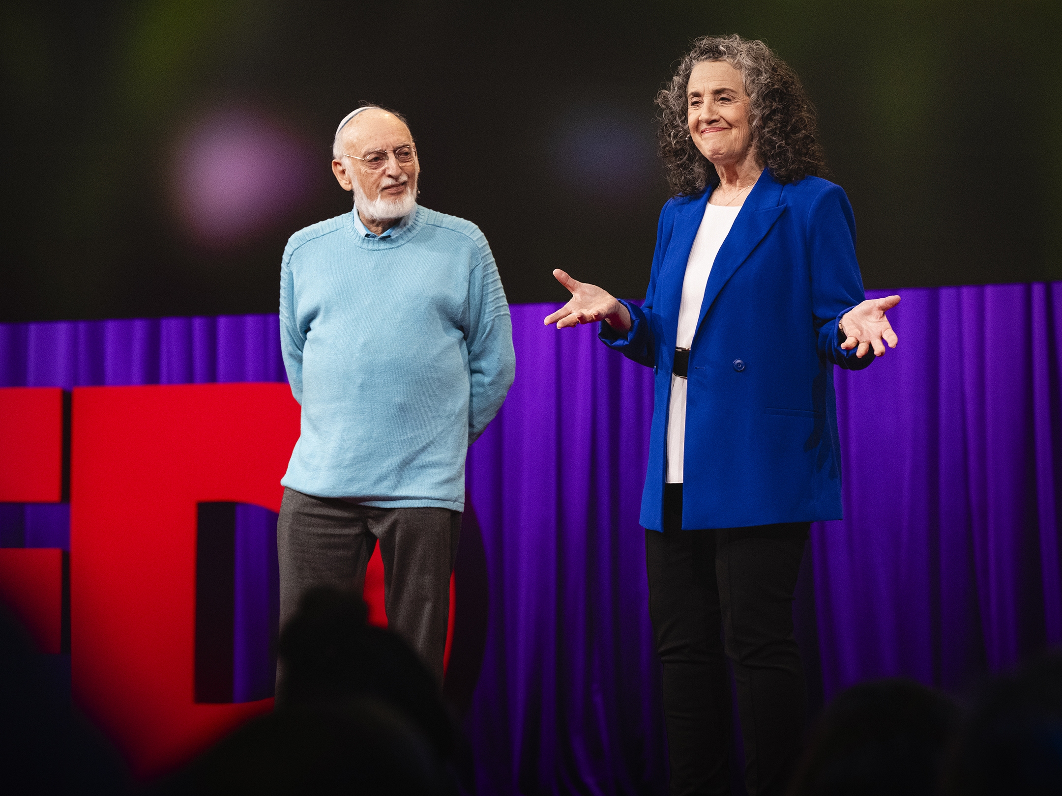 caption: John Gottman and Julie Gottman speak at TED2024