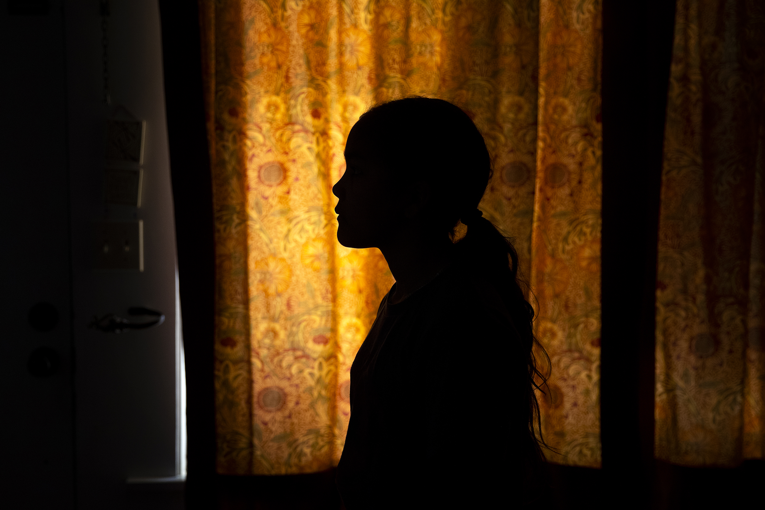 caption: Alejandra's daughter, age 11, is portrayed at Karina’s home, on Friday, Jan. 23, 2026, in Seattle. 