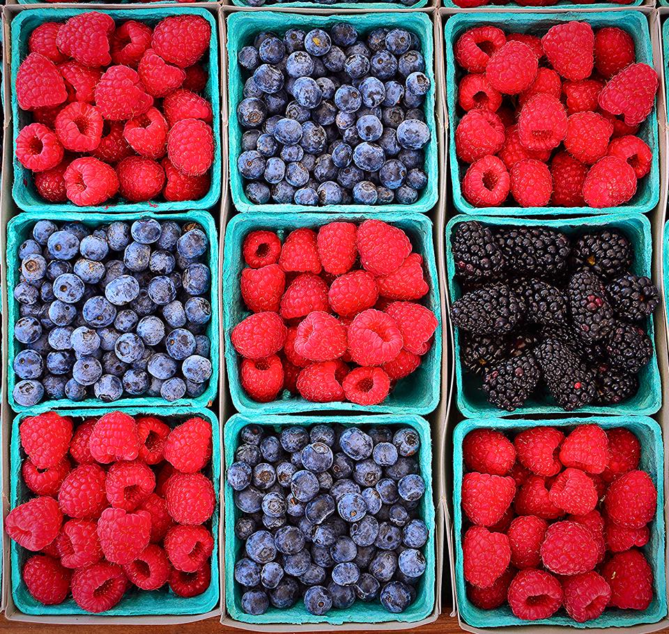 caption: Summer time is berry time at the farmers market.