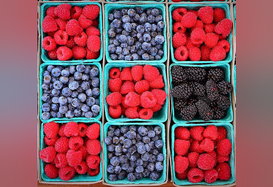 caption: Summer time is berry time at the farmers market.