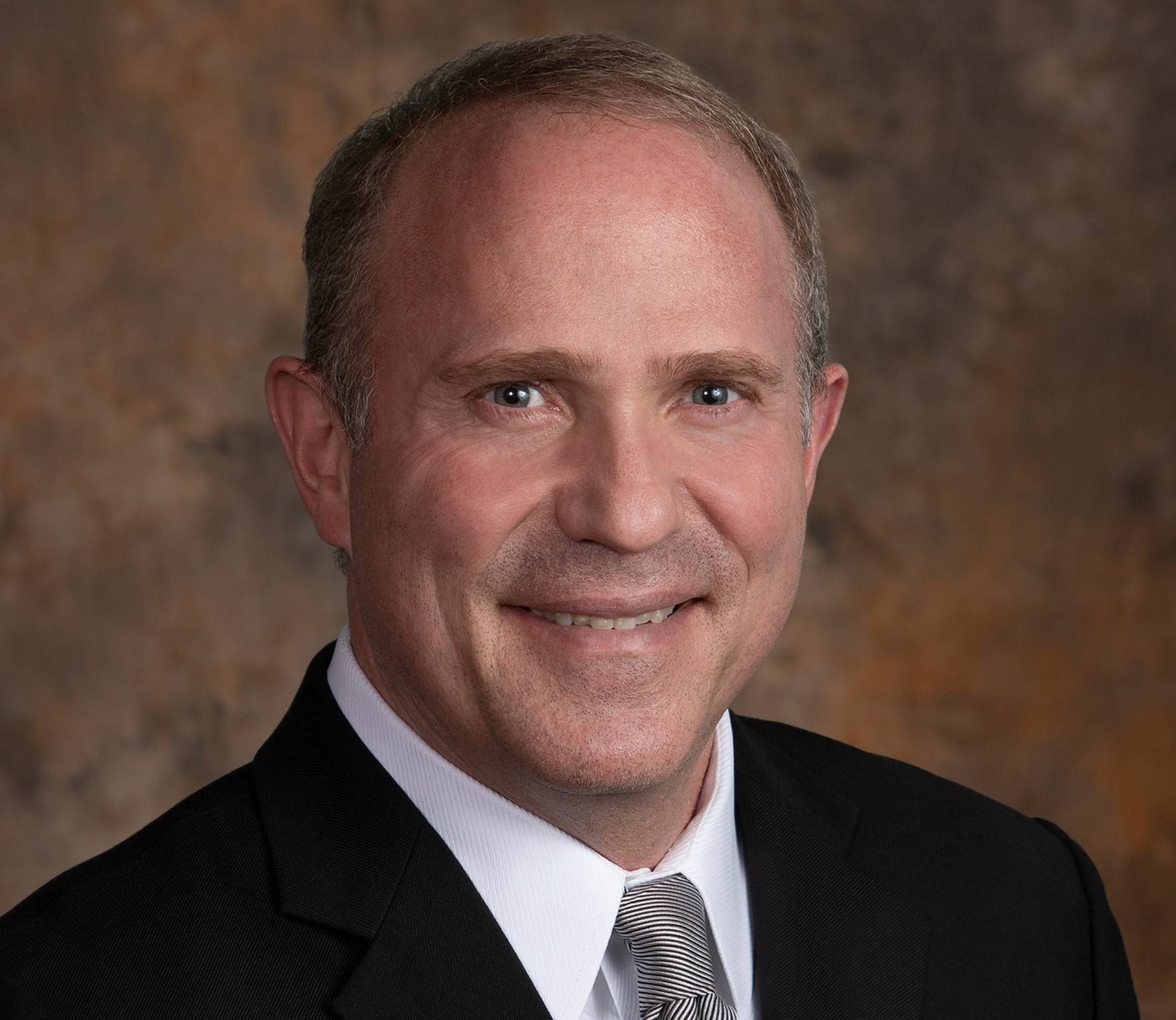 caption: Darin Goss, the chief executive of Providence Health and Services SW, says the current fifth wave of COVID-19 is the hardest yet.