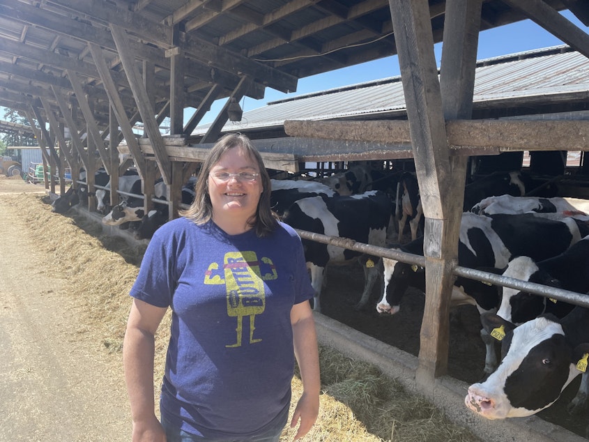 caption: Leann Krainick at her dairy farm in Enumclaw says high fuel prices driving up feed and other costs for farmers like her in the 8th Congressional District. 