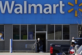 caption: Walmart has a plan to pay for its workers to get college degrees without going into debt.
