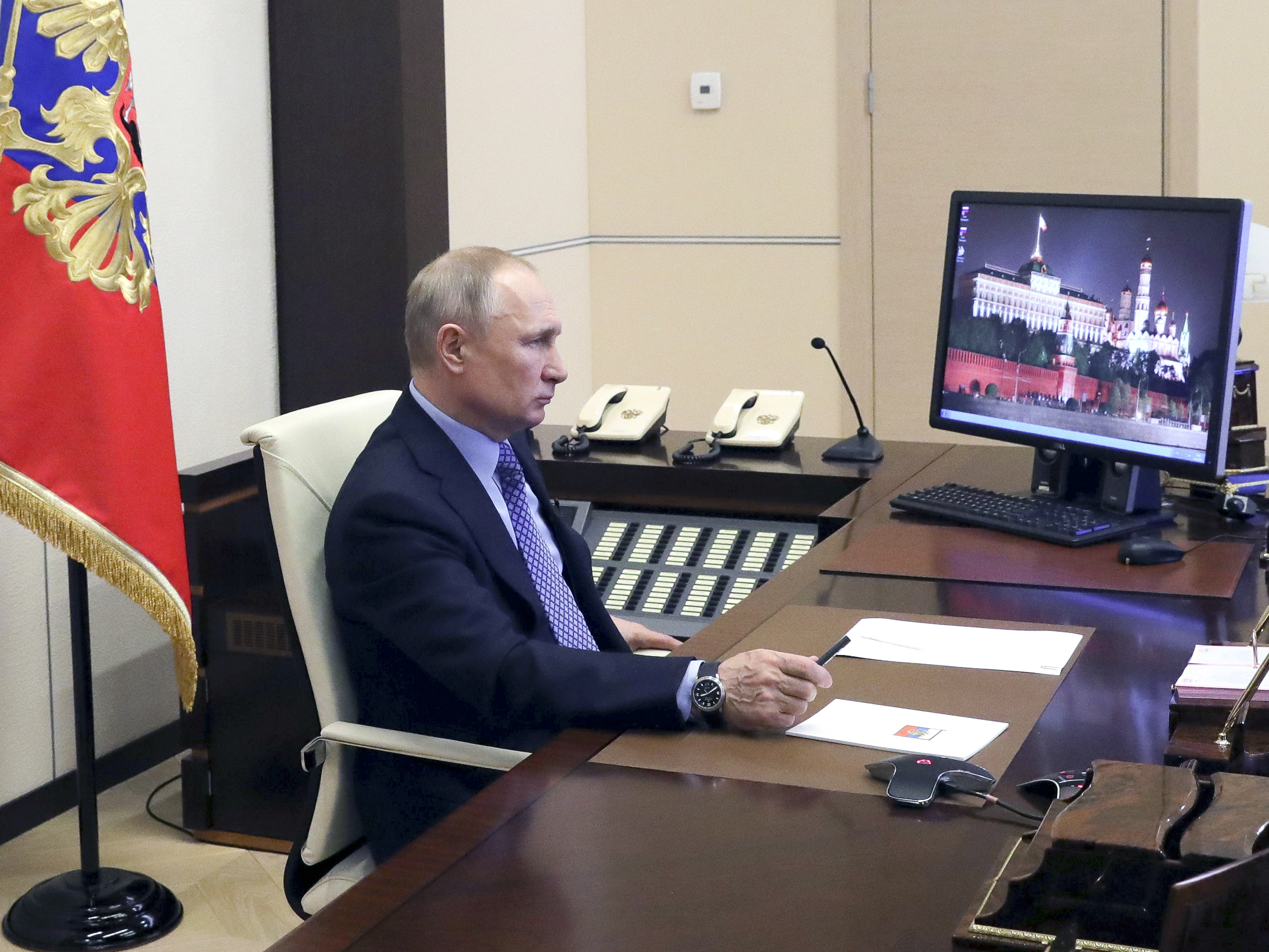 caption: Russian President Vladimir Putin chaired a meeting with Russian regional officials via videoconference at the Novo-Ogaryovo residence outside Moscow, Russia, Monday, March 30, 2020.