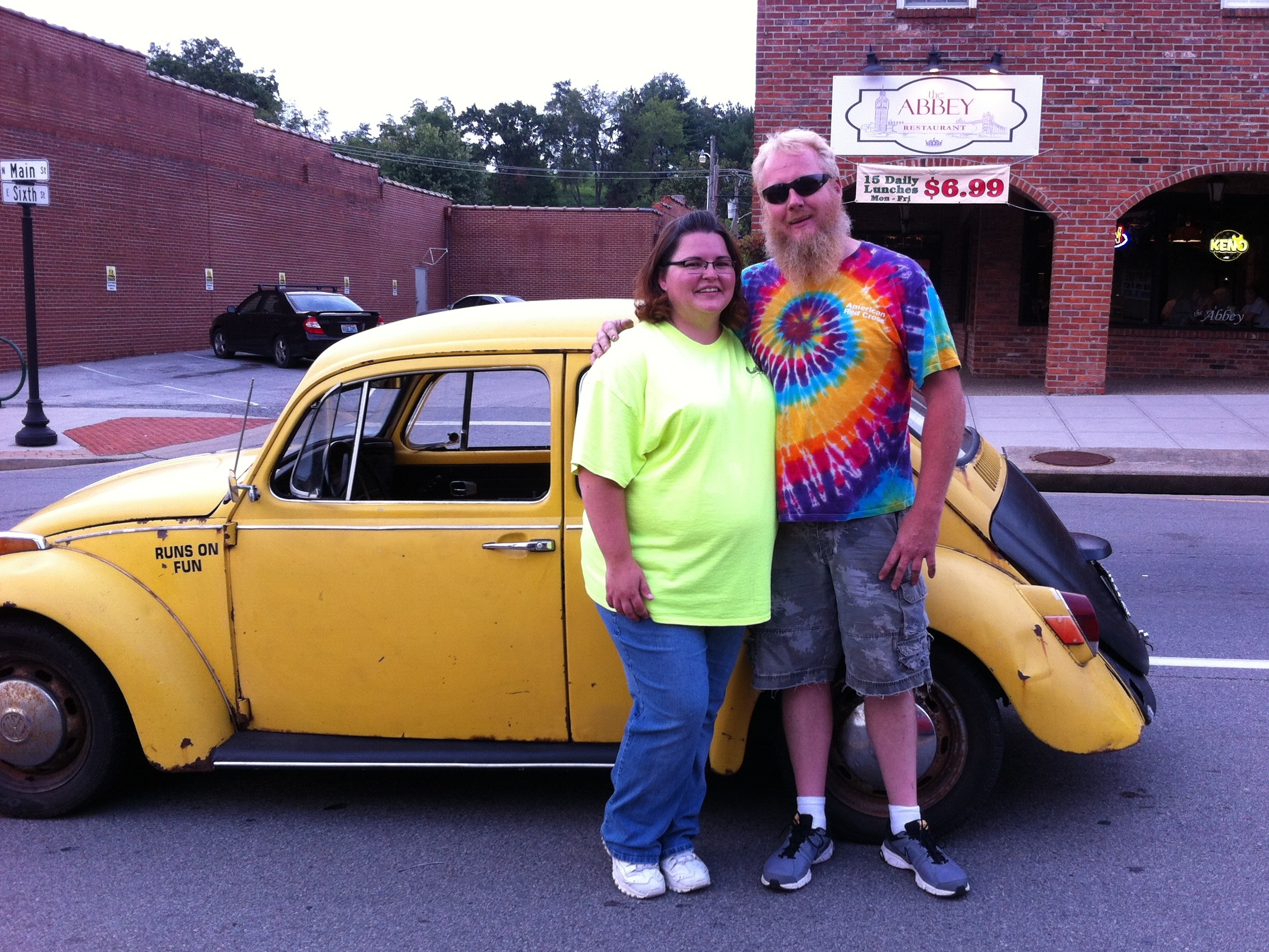 caption: Jessica Bray and her husband, Anthony Bray, pose with their 1970 Volkswagen Beetle. Anthony converted his Beetle to an electric car. "As a special touch, we added bubble machines to the back to blow bubbles at car shows and as we drive," Jessica said.