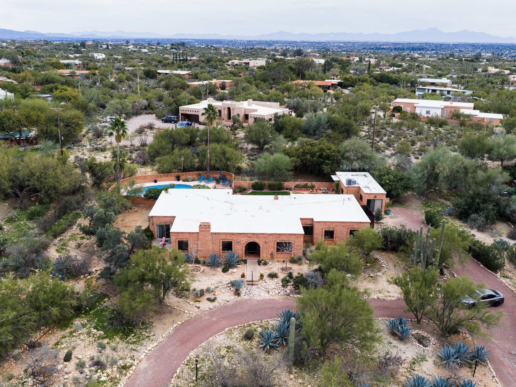 caption: The home of Nancy Guthrie, the missing mother of "Today" show host Savannah Guthrie, is seen from above, Thursday, Feb. 5, 2026, in Tucson, Ariz.
