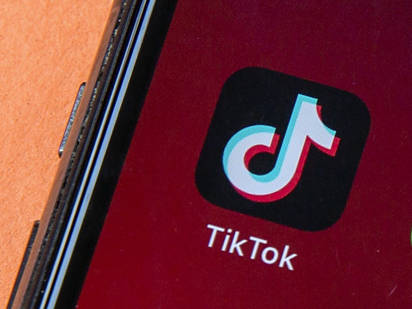 caption: Icons for the smartphone apps TikTok and WeChat are seen on a smartphone screen in Beijing. President Trump said he does not plan to support any deal to save TikTok in the U.S. that keeps China-based ByteDance as its majority owner.