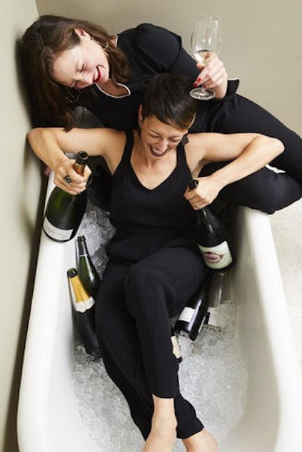 caption: <p class="p1"><span class="s1">Dana Frank and Andrea Slonecker pair Champagne with laughs in a bathtub.</span></p>