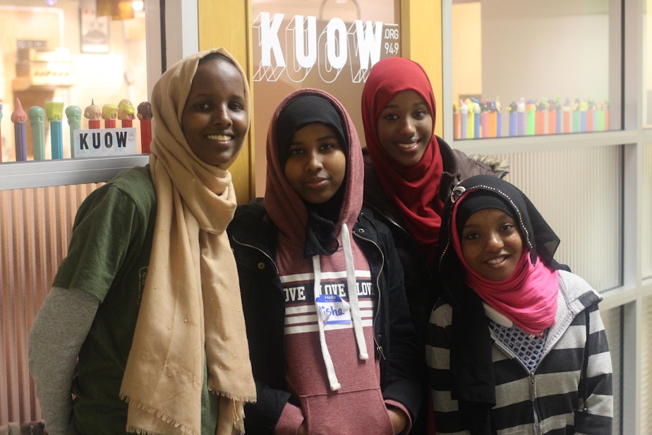caption: RadioActive's Zuheera Ali (left) with Coalition for Refugees from Burma participants Aisha Abdirizak, Hibo Yussuf, and Sabrina Abdullahi after recording their script in KUOW's studios.