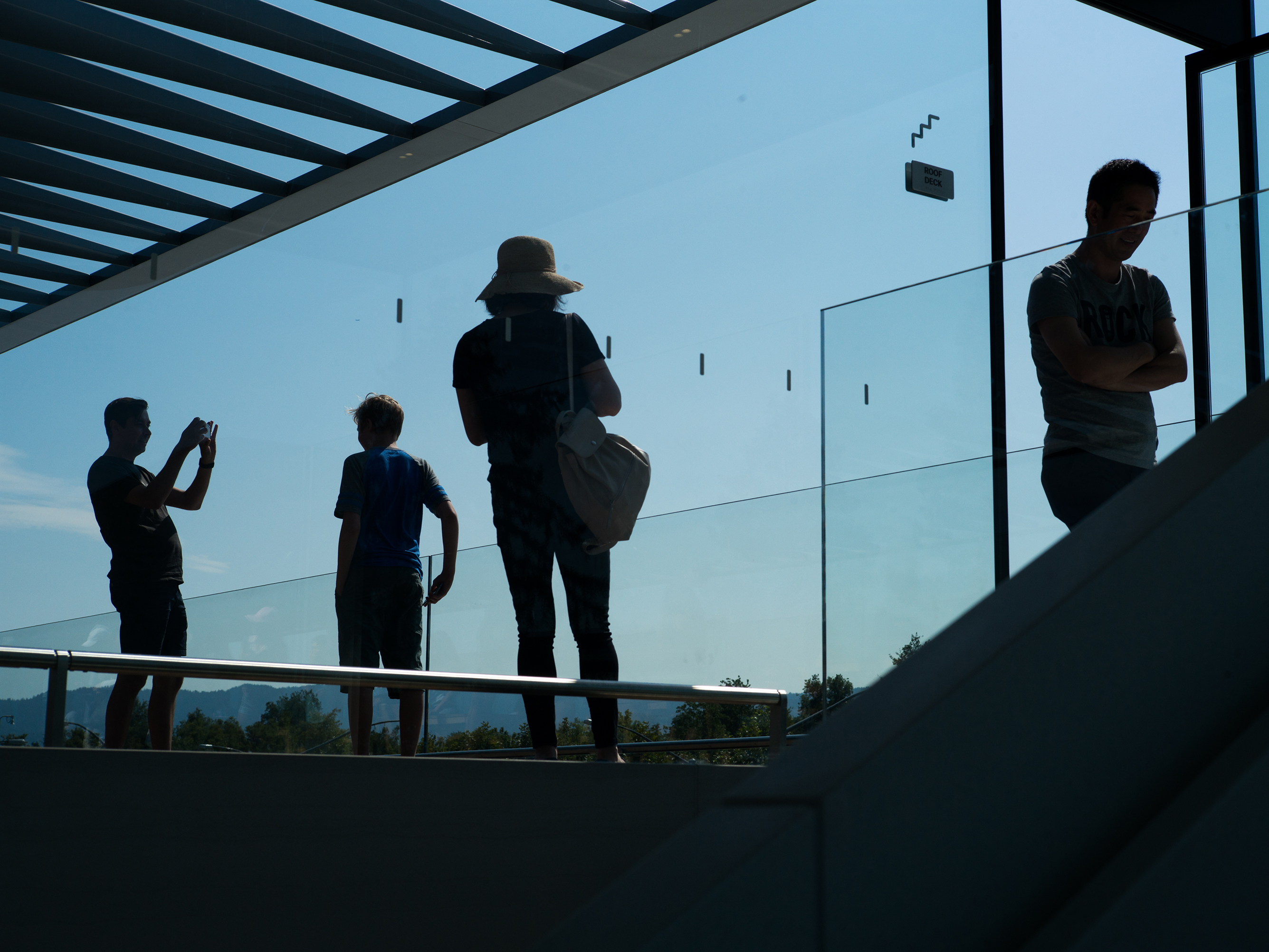 caption: Apple Park's visitor center has a store, cafe and roof with views of the main building for the public.
