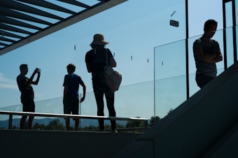 caption: Apple Park's visitor center has a store, cafe and roof with views of the main building for the public.