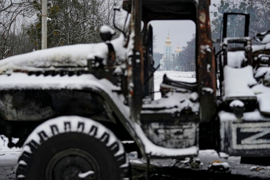 caption: A destroyed Russian military multiple rocket launcher vehicle is coated in fresh snow on the outskirts of Kharkiv, Ukraine, Friday, Feb. 25, 2022. Russian troops bore down on Ukraine's capital Friday, with gunfire and explosions resonating ever closer to the government quarter, in an invasion of a democratic country that has fueled fears of wider war in Europe and triggered worldwide efforts to make Russia stop.