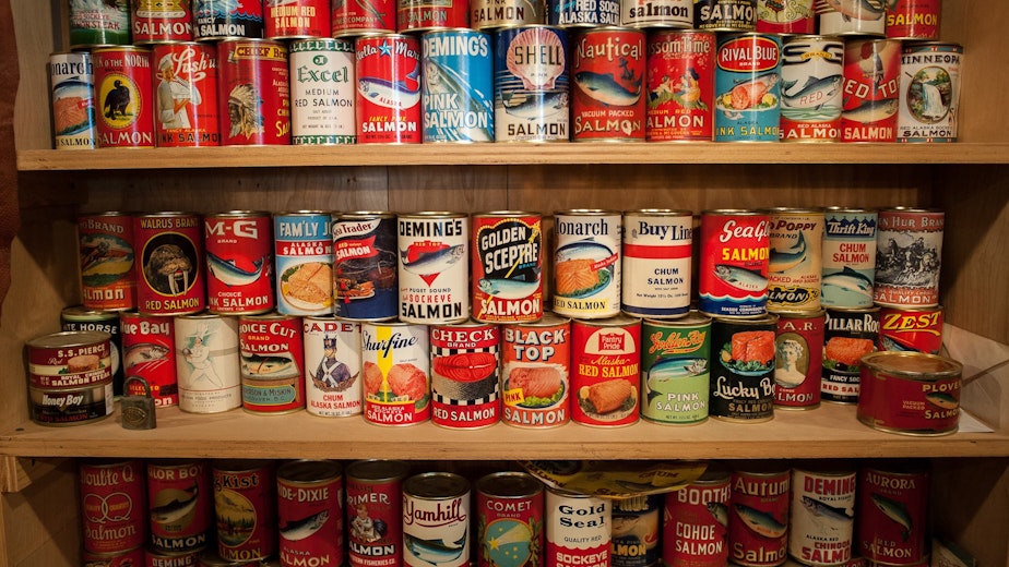 caption: Replica salmon cans from Bellingham's once-mighty Pacific American Fisheries. Curator Gordon "Gordy" Tweit displays these and other artifacts of Bellingham's past in a museum under the Fairhaven Pharmacy.