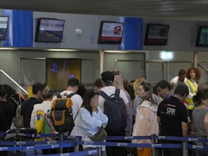 caption: Passengers wait in a queue, to enter a flight to Israel, at the Eleftherios Venizelos International Airport in Athens, Greece, Tuesday, Oct. 10, 2023.