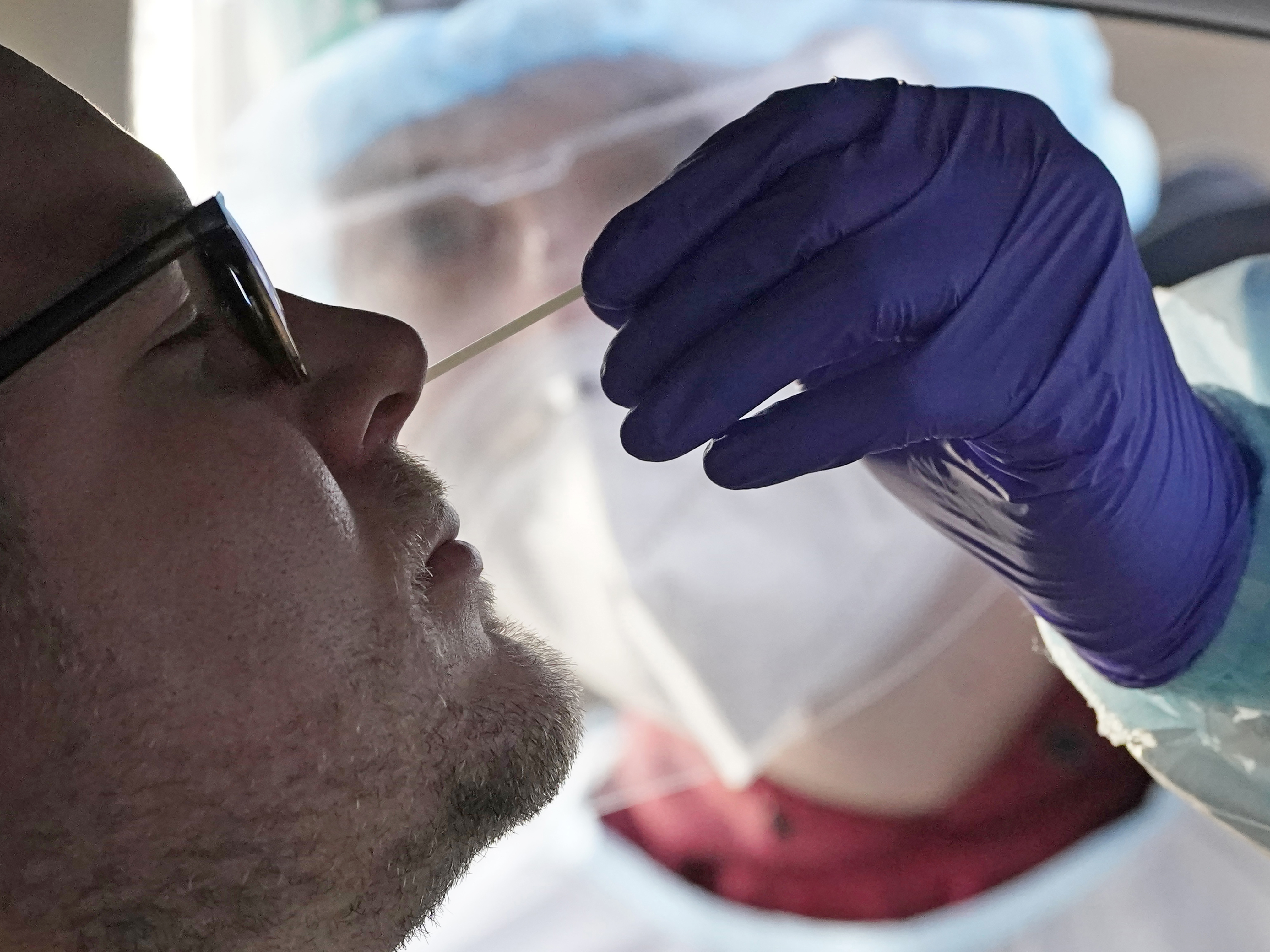 caption: The federal government has approved the first at-home coronavirus test. Pictured is a more-typical testing site in Salt Lake City on Tuesday. The at-home tests could provide faster results.