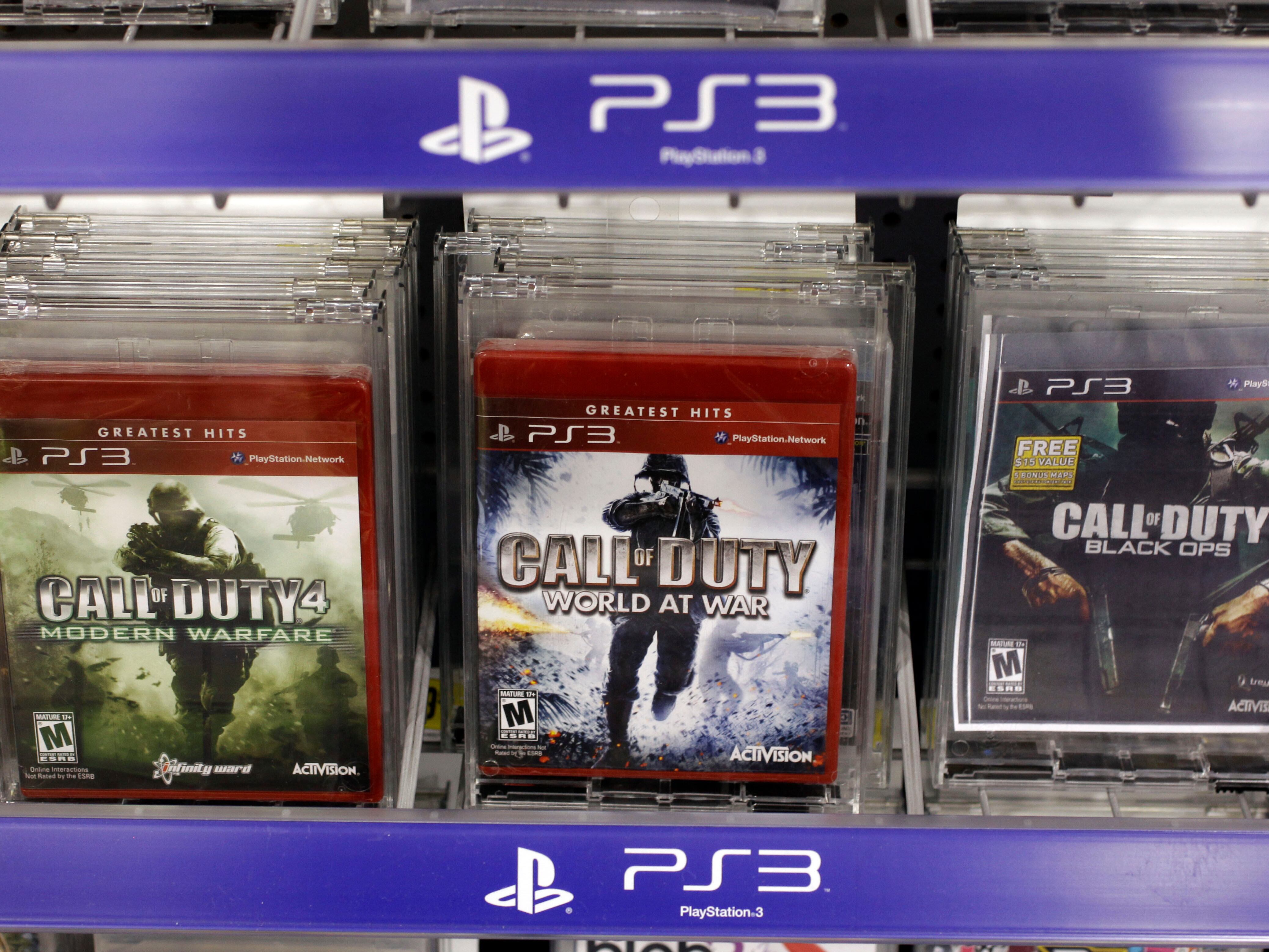 caption: Three versions of Activision's Call Of Duty games are seen on sale at a Best Buy store in Mountain View, Calif., in 2011. Vince Zampella, one of the creators behind the best-selling video games, has died at age 55.