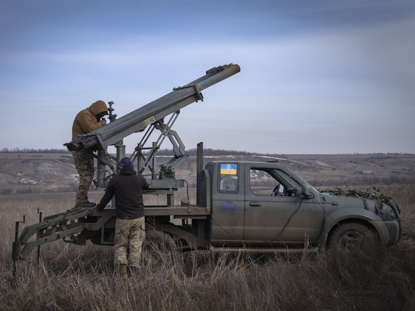 caption: Ukrainian soldiers from The 56th Separate Motorized Infantry Mariupol Brigade prepare to fire a multiple launch rocket system based on a pickup truck towards Russian positions at the front line, near Bakhmut, Donetsk region, Ukraine, March 5, 2024.