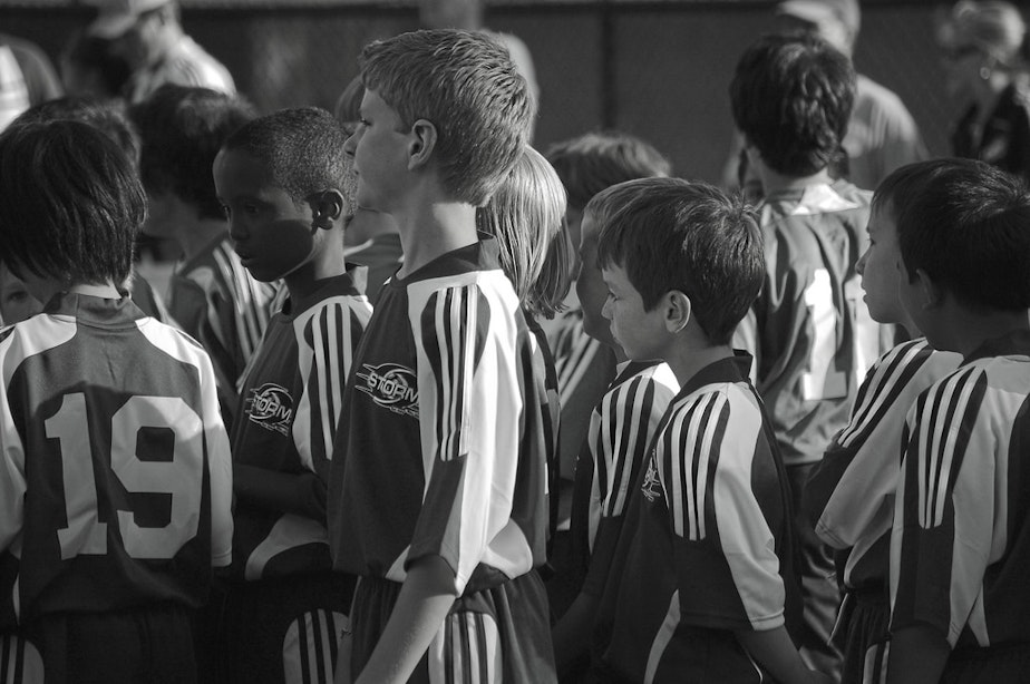 caption: FILE: Youth soccer players participate in pregrame activities at a Seattle Sounders game, June 12, 2008.