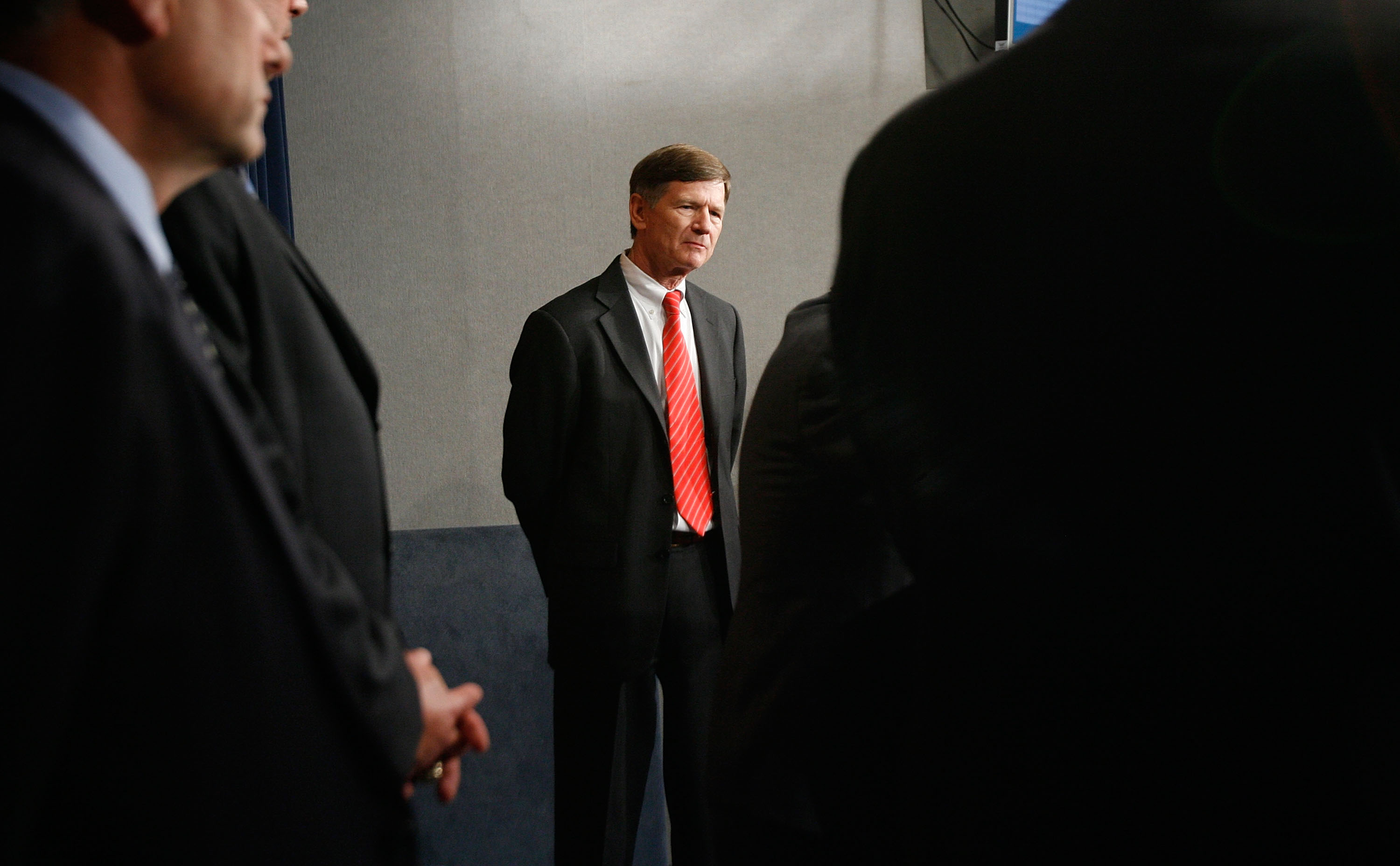 caption: U.S. Rep. Lamar Smith's seat in Texas's 21st Congressional District is open for the first time in decades. Here, Smith is joined by fellow congressmen during a news conference about immigration reform at the US Capitol May 8, 2007 in Washington, DC. (Chip Somodevilla/Getty Images)