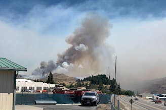 caption: The Red Apple fire burns near Wenatchee, Washington, on July 14, 2021.