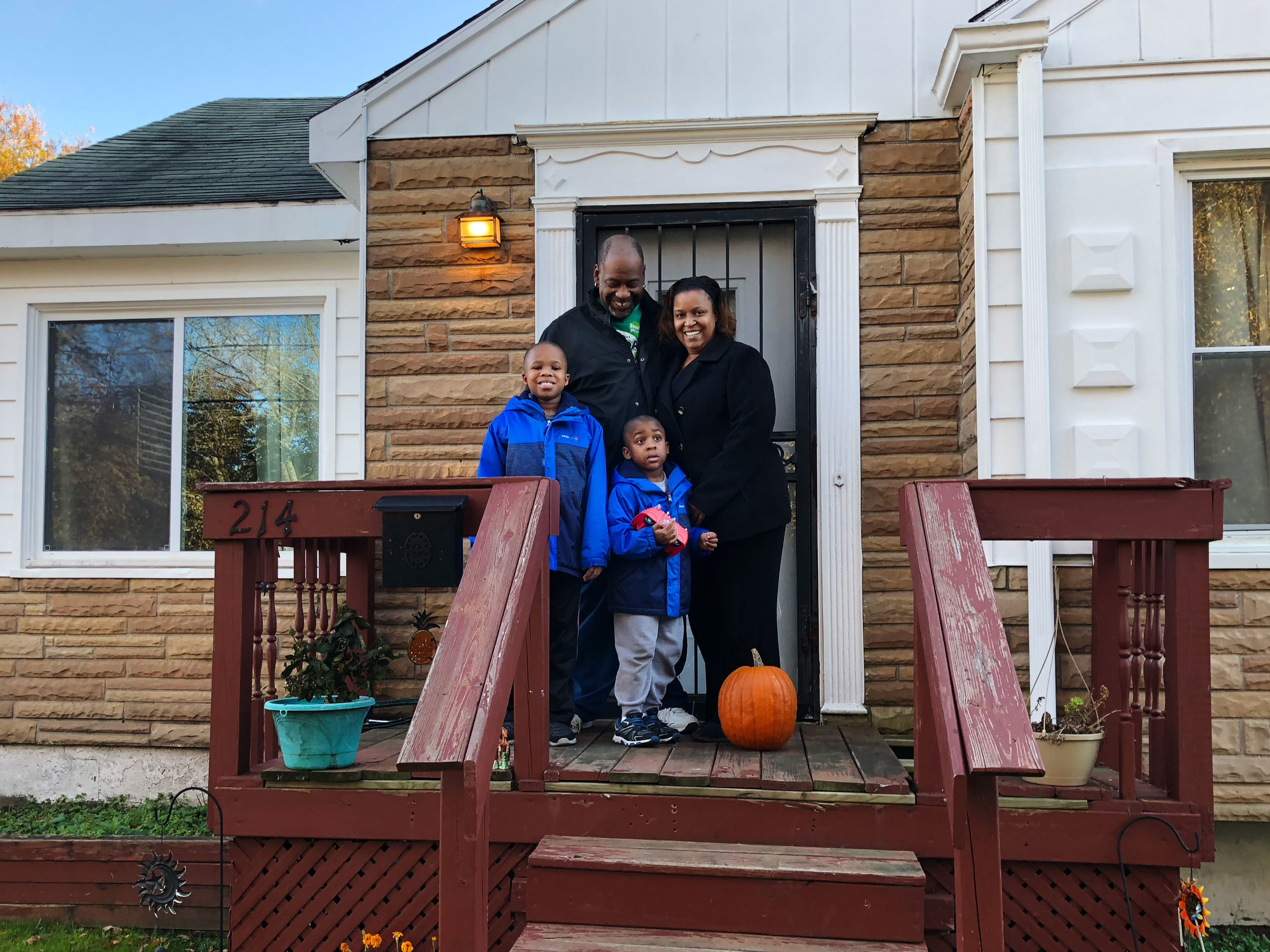 caption: Flint residents Earl (left) and Jeneyah McDonald still purchase bottled water for drinking and cooking. Their sons, Justice, 9, and Josiah, 5, have grown up in Flint as the water crisis unfolded.