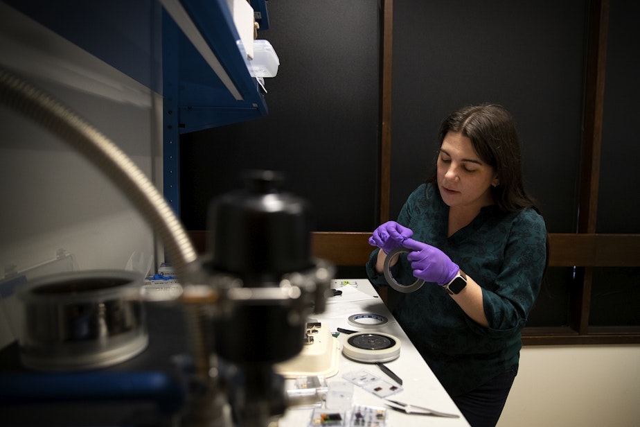caption: Linda Conway, senior product engineer at Lumotive, prepares a sample to analyze under SEM (scanning electron microscope) by applying a thin layer of platinum coating to the semiconductor chip on Thursday, May 25, 2023, at Lumotive’s lab in Redmond. 