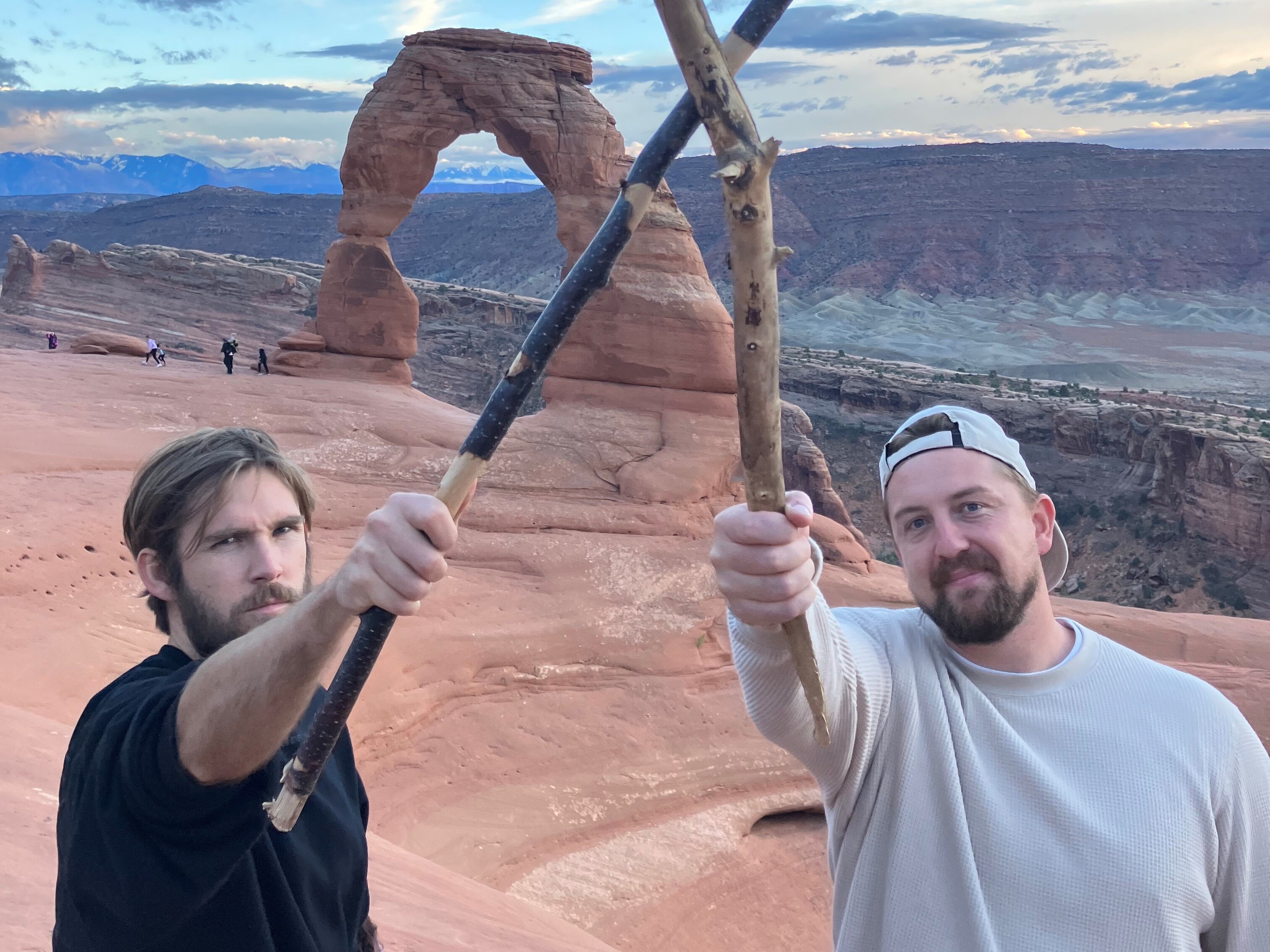 caption: Boone Hogg (left) and Logan Jugler, who run the account @officialstickreviews, show off their sticks.