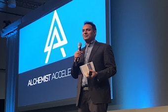 caption: Ravi Belani, managing director at Alchemist Accelerator, speaks at a recent presentation by the startup in Sunnyvale, Calif.