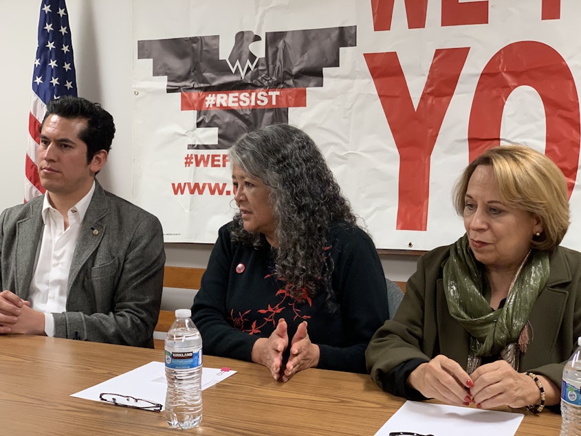 caption: From left, Mexican Sen. Israel Zamora, United Farm Workers President Teresa Romero and Sen. Bertha Alicia Caraveo hold a press conference Monday, Jan. 27, after meeting with dairy workers. They shared stories of poor working conditions on farms.