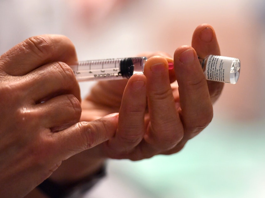 caption: Minnesota has administered about 39% of the vaccine doses it has received. About 1.5% of the state's population has been vaccinated.
