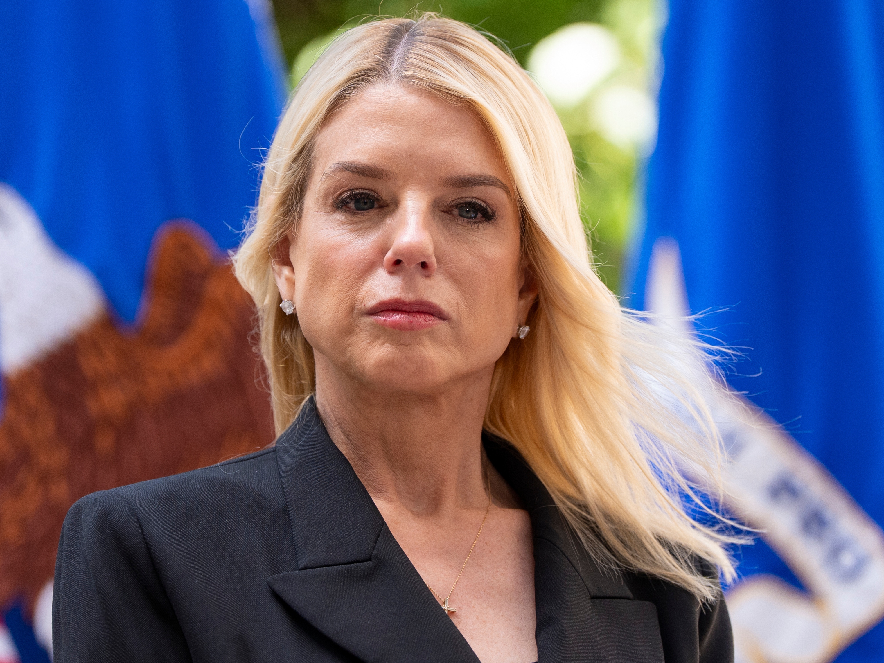 caption: Attorney General Pam Bondi listens during a news conference at the Department of Justice on May 7, 2025 in Washington. In late April, the DOJ's Office of Justice Programs cancelled hundreds of public safety grants to local police and nonprofits, leaving many scrambling.