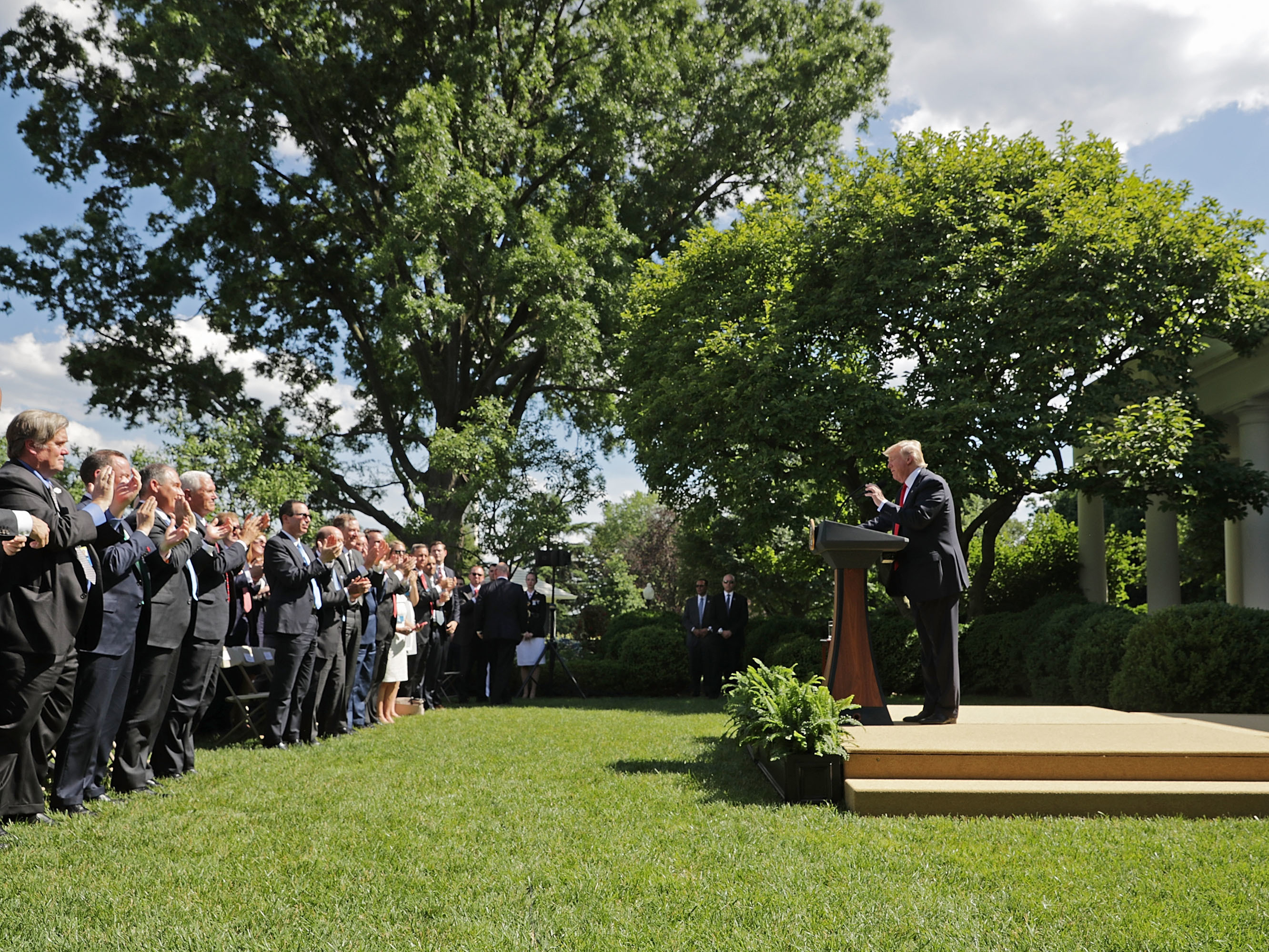 caption: President Trump receives a standing ovation while announcing his decision to pull the United States out of the Paris climate agreement, June 1, 2017.