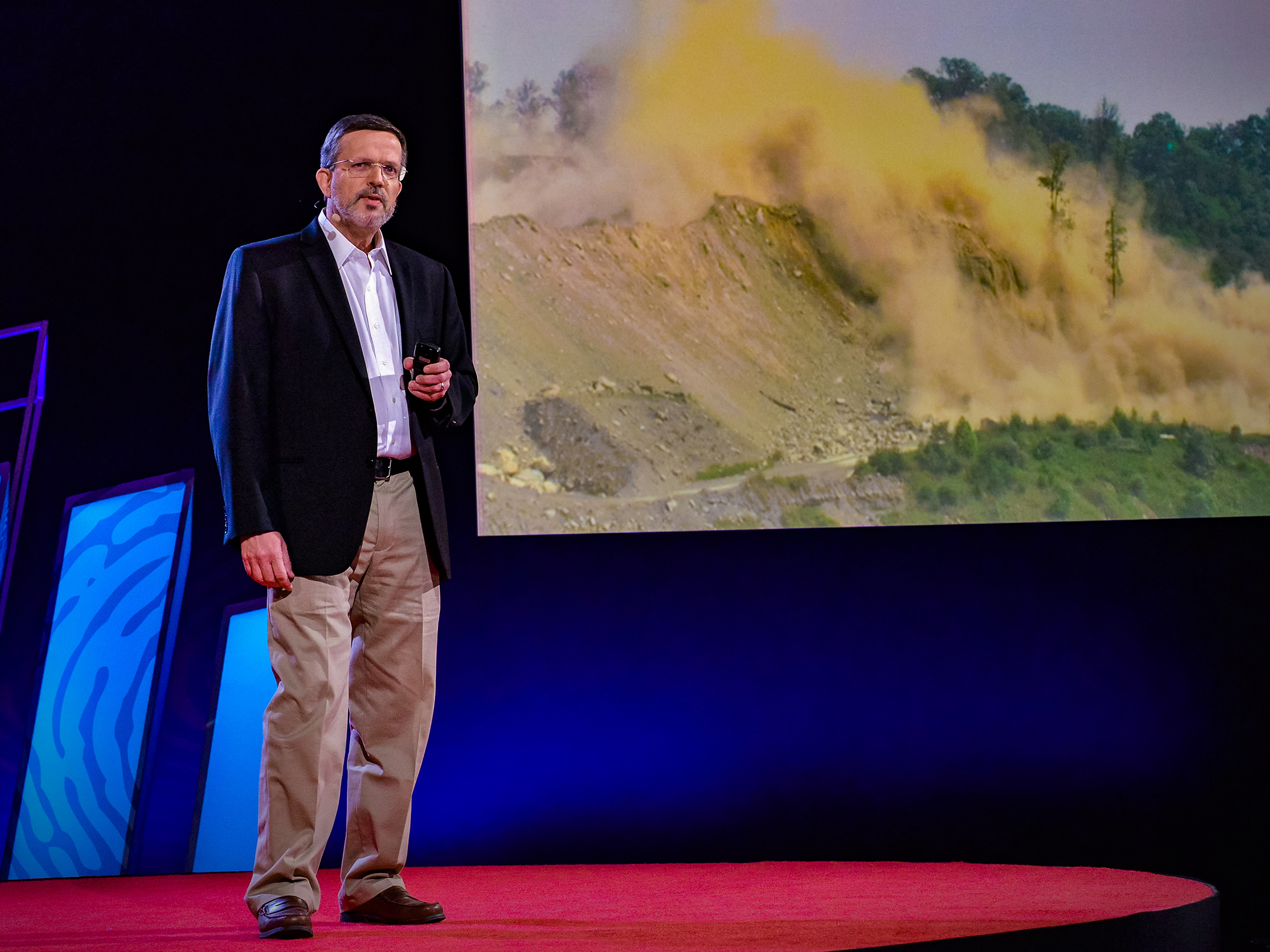 caption: Michael Hendryx on the TED stage.