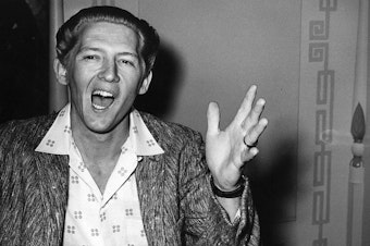 caption: Jerry Lee Lewis, in a photo taken during his infamous trip to London in June 1958, when it became public that he was married to his 13-year-old cousin.