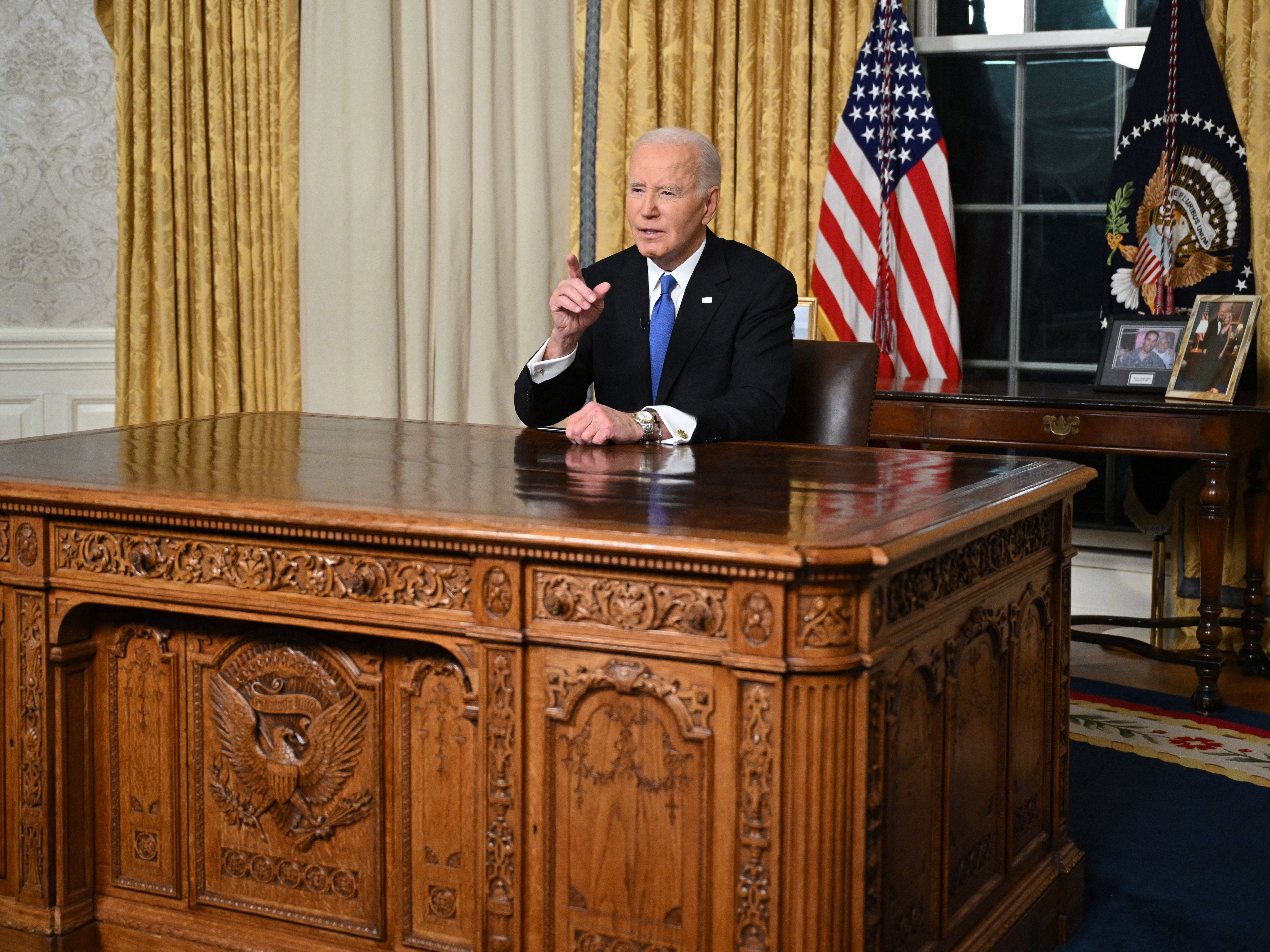 caption: Presiden Biden delivers his farewell address to the nation from the Oval Office.