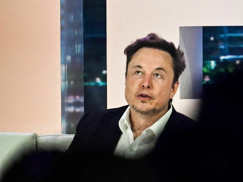caption: Twitter CEO Elon Musk speaks at the "Twitter 2.0: From Conversations to Partnerships" marketing conference in Miami Beach, Fla., in April.