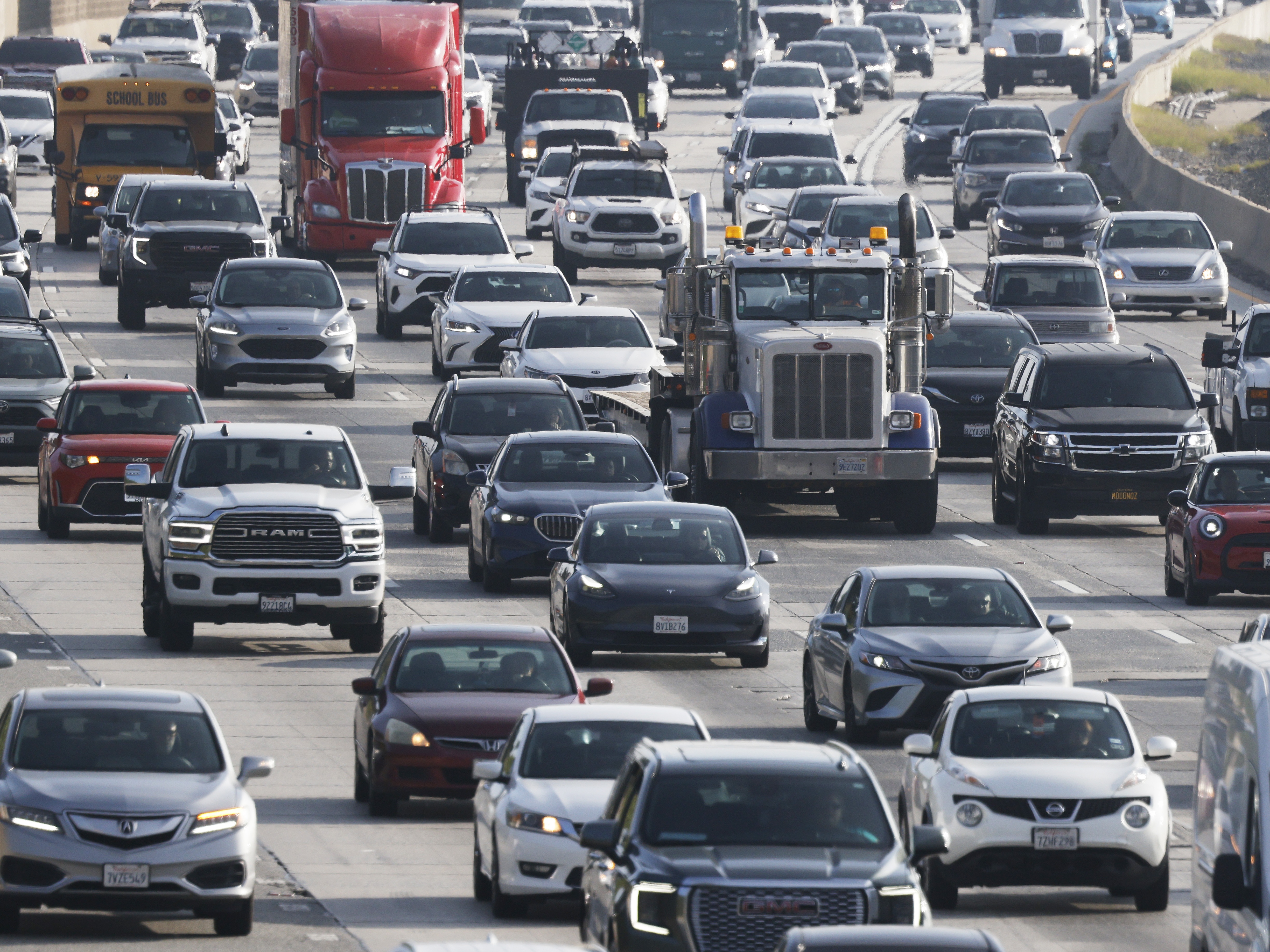 caption: Motorists drive on Interstate 210 during the morning commute on December 03, 2025 in Pasadena, Calif. President Trump announced new fuel economy standards today which will roll back fuel efficiency standards put in place by former President Joe Biden.