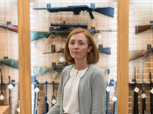 caption: Dr. Emmy Betz, a co-founder of the Colorado Firearm Safety Coalition, led a meeting of the group at the Centennial Gun Club. "If you want to reduce suicide deaths, you have to talk about firearms," Betz says. "And if you want to reduce firearm deaths, you have to talk about suicide."