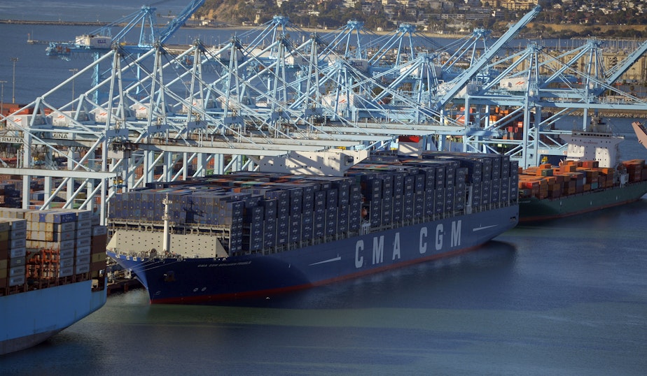 caption: The CMA CGM Benjamin Franklin, the largest container ship to ever make port in North America, unloads its cargo in the Port of Los Angeles in San Pedro, Calif., on Saturday, Dec. 26, 2015.