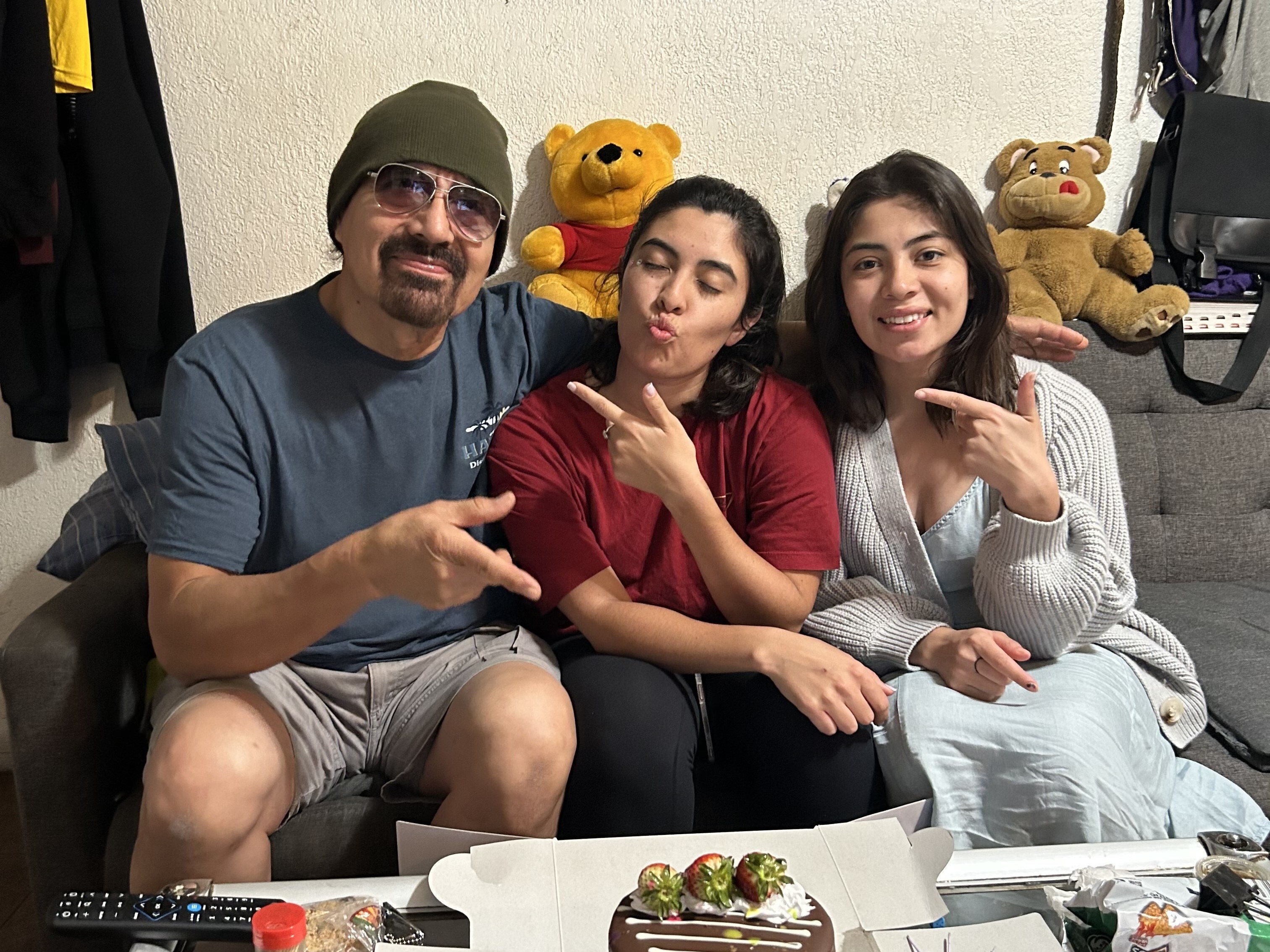 caption: Francisco Urizar celebrates his 64th birthday with his daughters Nancy (center) and Francis (right). Since her father was taken into Immigrations and Customs Enforcement custody earlier in the week, Nancy has been frantically searching for clues about where, and why, he has been detained.