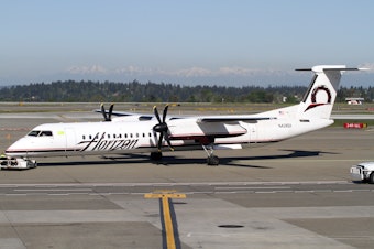 caption: Horizon Air Bombardier DHC8-Q400 at Sea-Tac Airport. A plane of this model is the one that was hijacked and crashed in Pierce County, just south of the airport.