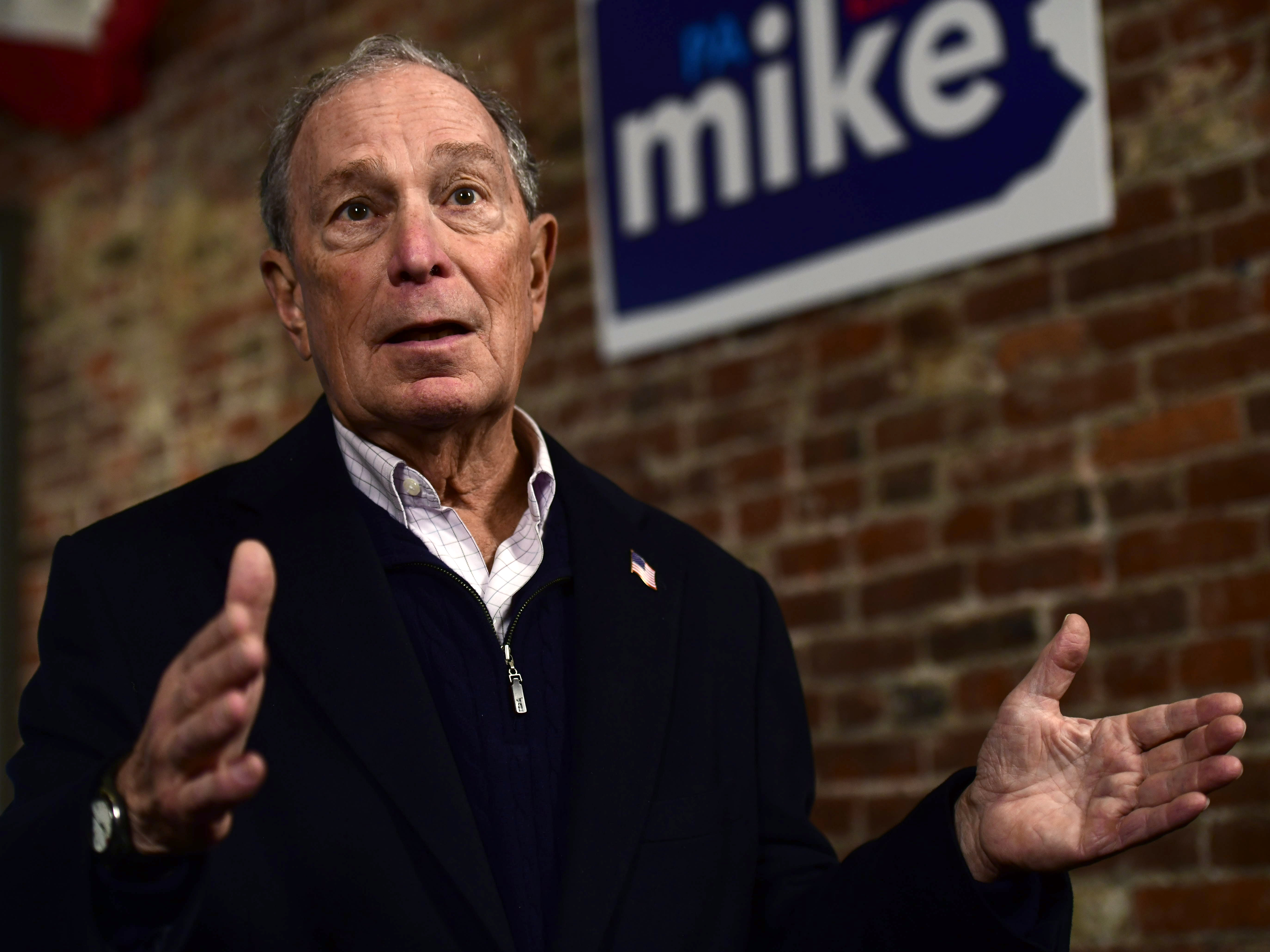 caption: Democratic presidential candidate Michael Bloomberg confirmed a report on Tuesday that calls on behalf of his campaign were being made by prison workers. He is seen here campaigning in Philadelphia on Saturday.