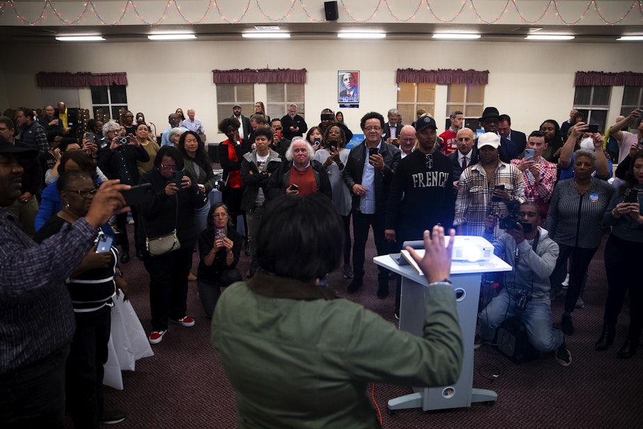 caption: Seattle City Council candidate in the 3rd District, Joy Hollingsworth, speaks to friends, supporters, and family members after initial results showed her in the lead during an election night party at the First AME Church on Tuesday, Nov. 7, 2023, in Seattle. 