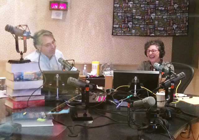 caption: KUOW's Steve Scher and Marcie Sillman have some fun while pitching on Friday.