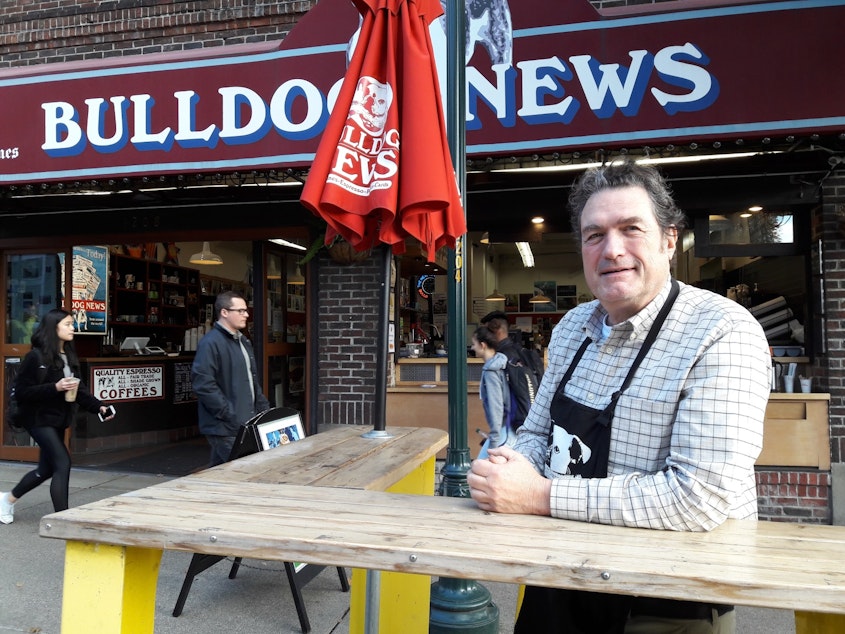 caption: Doug Campbell owns Bulldog News on the Ave.