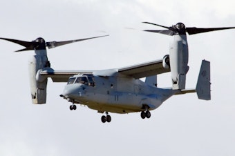 caption: One of two MV22 Osprey tilt-rotor transport aircraft arrives at the Futenma Air Station in Okinawa Prefecture on Aug. 3, 2013.